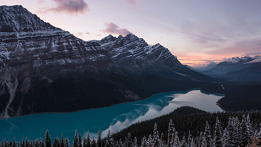 mountain covered with snow with body of water thumbnail