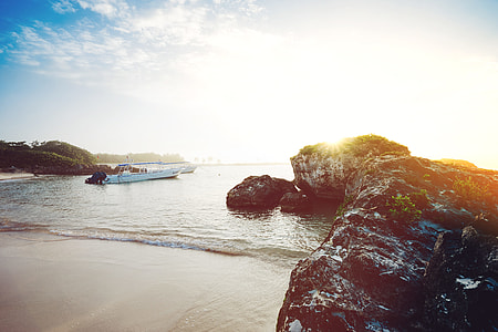 boat at body of water during daytime thumbnail