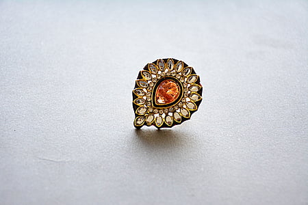 silver-colored earring with gemstone thumbnail