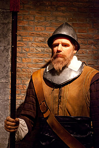 man wearing brown, white, and gray suit thumbnail