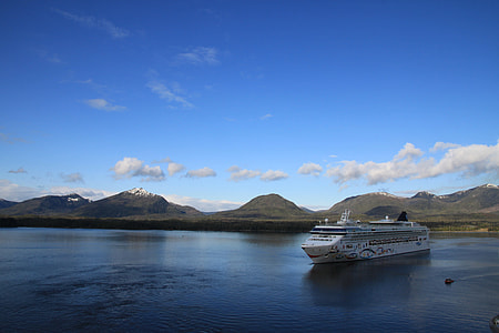 white cruise ship on body of water during day time thumbnail
