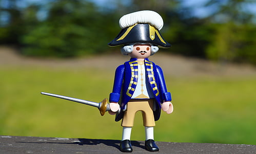 selective focus photography of royal soldier holding sword action figure thumbnail