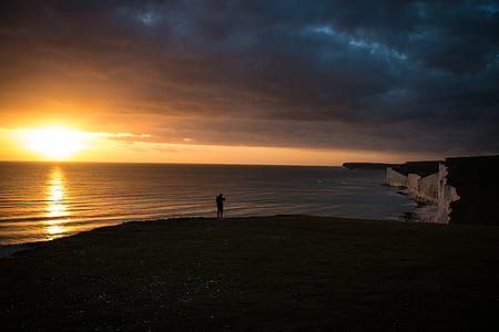 man standing on seashore thumbnail