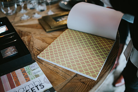 Golden photo frame and decorative paper on a table thumbnail