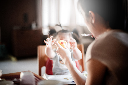 woman feeding baby thumbnail