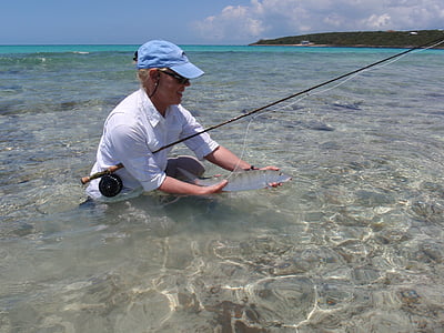 man holding fish thumbnail
