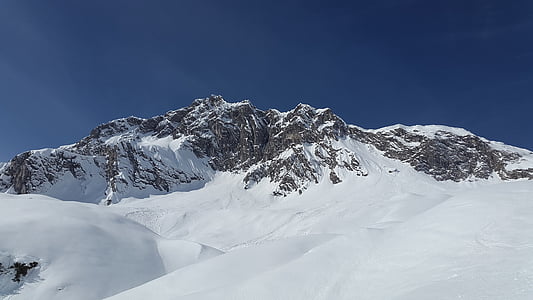 snow covered grey mountain at daytime thumbnail