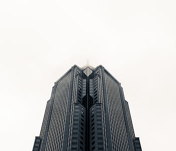 worms eye view of concrete building during daytime thumbnail