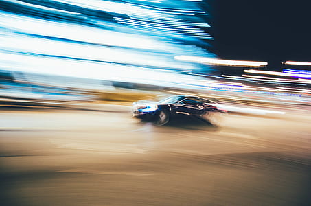 time lapse photography of car on road during night thumbnail