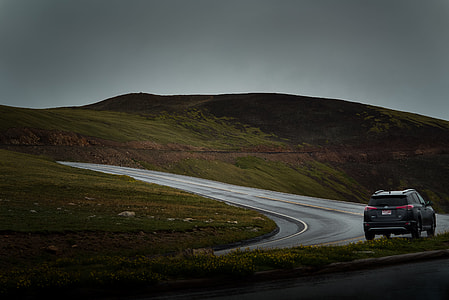 photography of vehicle near mountain thumbnail