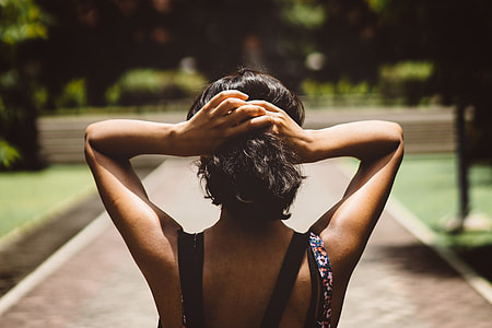 A woman adjusting her hair thumbnail