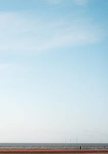 wind turbines on body of water thumbnail