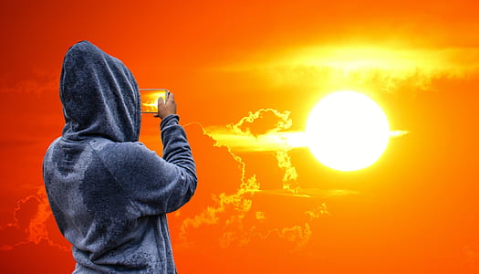 person taking sunset photo thumbnail