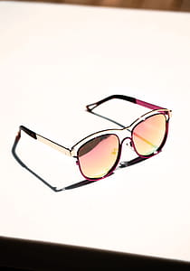 Pink Sunglasses On White Photo thumbnail