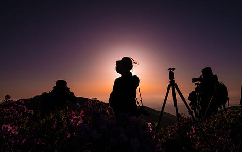 silhouette of a person standing under the sun thumbnail