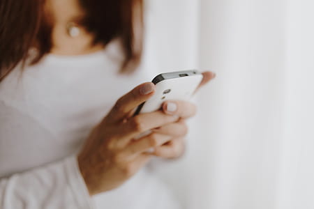 Beautiful young woman using smartphone thumbnail