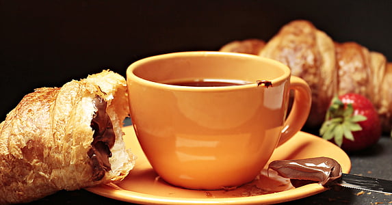 orange ceramic cup and saucer and bread thumbnail