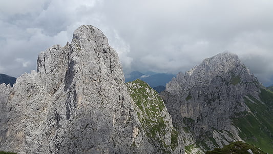 gray mountain under cloudy sky thumbnail