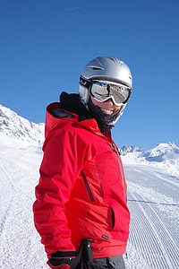 man standing on snow-covered mountain during day time thumbnail