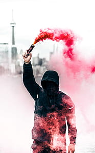 man holds red flair thumbnail