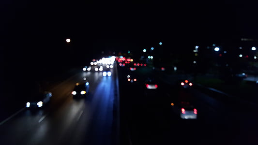 vehicles on road at nighttime thumbnail