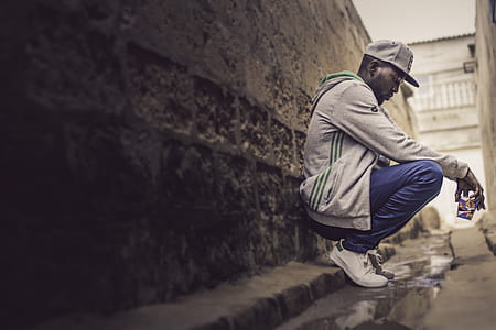 man leaning on wall thumbnail