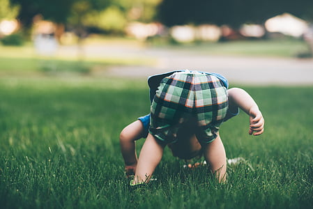 boy stepping on grass thumbnail
