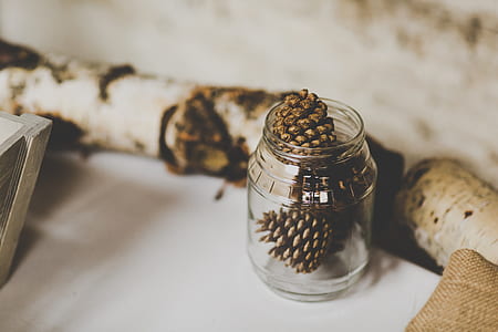 pine cones in clear glass jar thumbnail