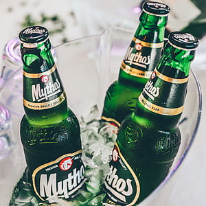 three Mythos beer bottles in ice bucket thumbnail