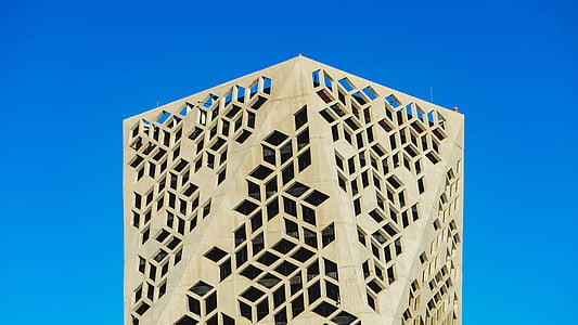 beige tower under blue sky thumbnail