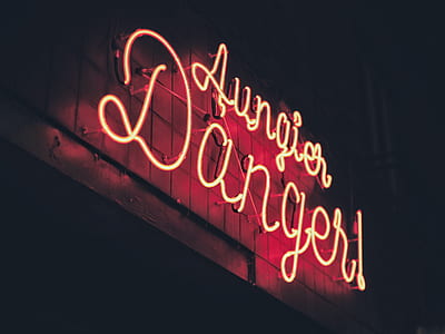 low angle photo of red lighted Lungier Danger neon light signage thumbnail