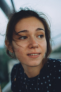 woman looking sideways with messy hair thumbnail