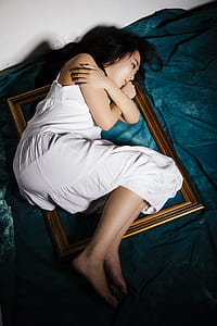 woman lying on top of photo frame thumbnail
