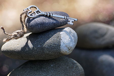 key placed on stack stones thumbnail