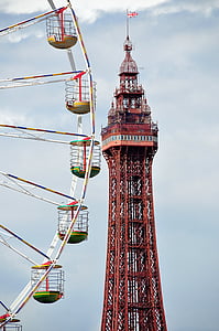 multicolored ferris wheel and red tower at daytime thumbnail