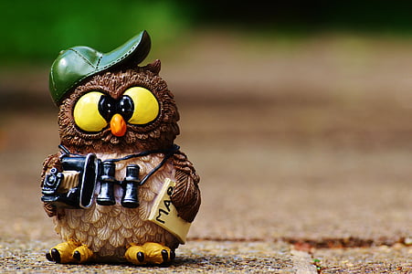 brown and yellow owl holding binocular figurine thumbnail