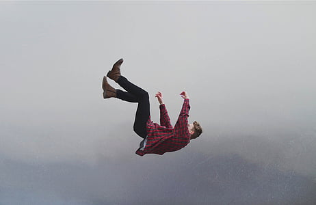 man falling from the skies during daytime thumbnail