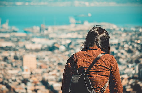 person looking at city from bird's eye view close-up photography thumbnail