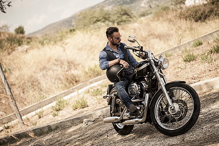 man sitting on motorcycle thumbnail