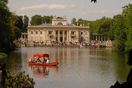 red boat on body of water thumbnail