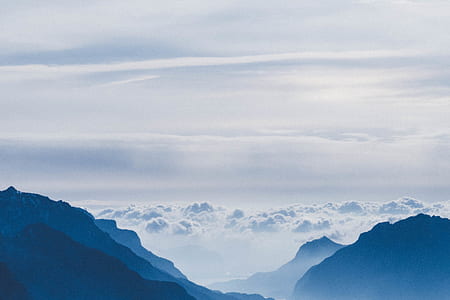 mountains covered with clouds during daytime thumbnail