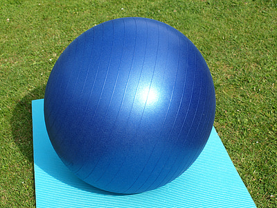 blue stability ball on teal mat thumbnail