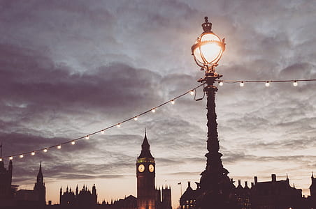 turned on street light near gothic building thumbnail