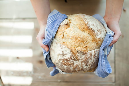 person holding baked bread thumbnail