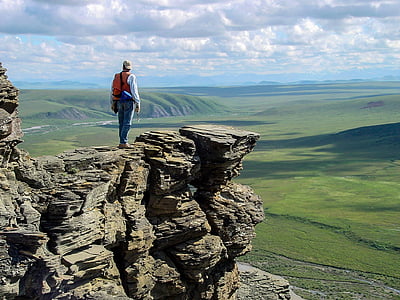 man standing on cliff thumbnail
