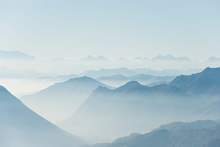 photo of mountain surrounded by fog during daytime thumbnail