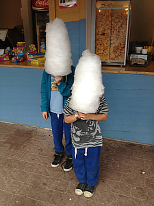 two toddler standing in front of a store thumbnail
