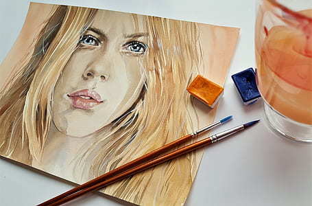 blonde haired woman painting thumbnail