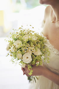 woman holding white rose bouquet thumbnail