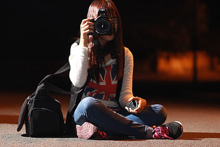Woman in White Long Sleeve Shirt Taking Picture during Nightie thumbnail